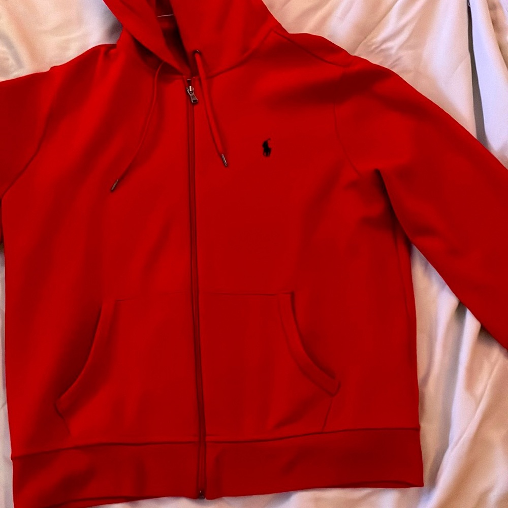 Here’s a sweater it’s size large and comes in red